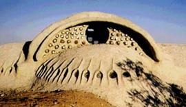 A PaperCrete and Glass Bottle House